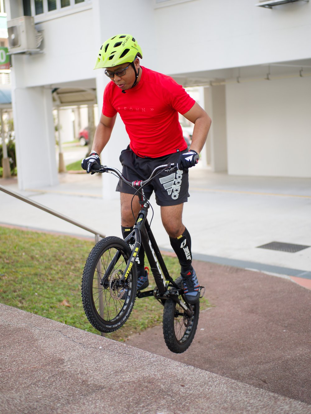 Yazid riding a mountain bike trials line